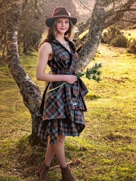 Our Collection woman in tartan dress